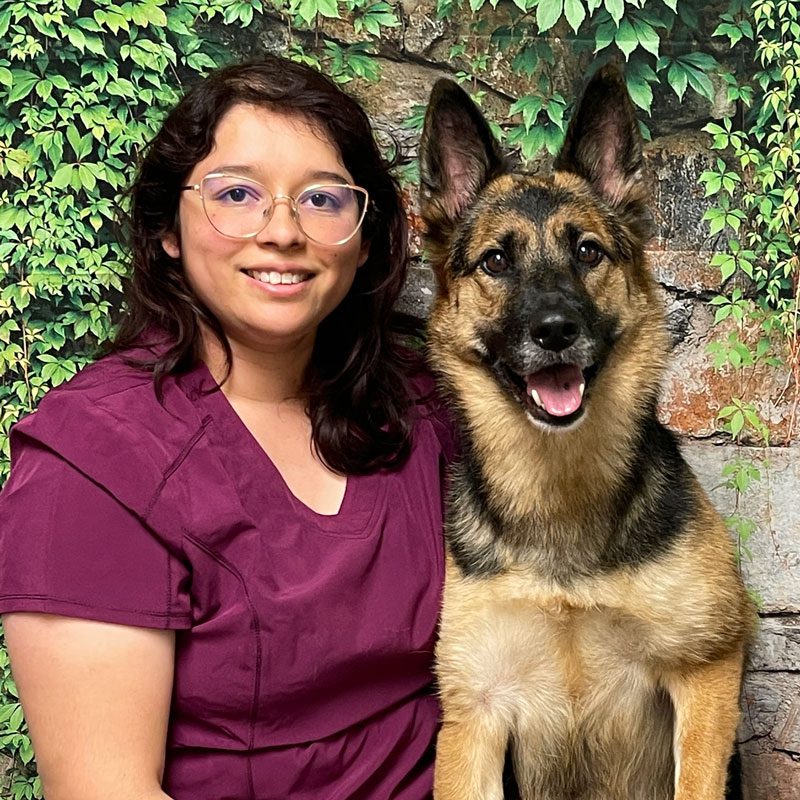 Maribel Lead Client Service Representative Smiling With Her Dog